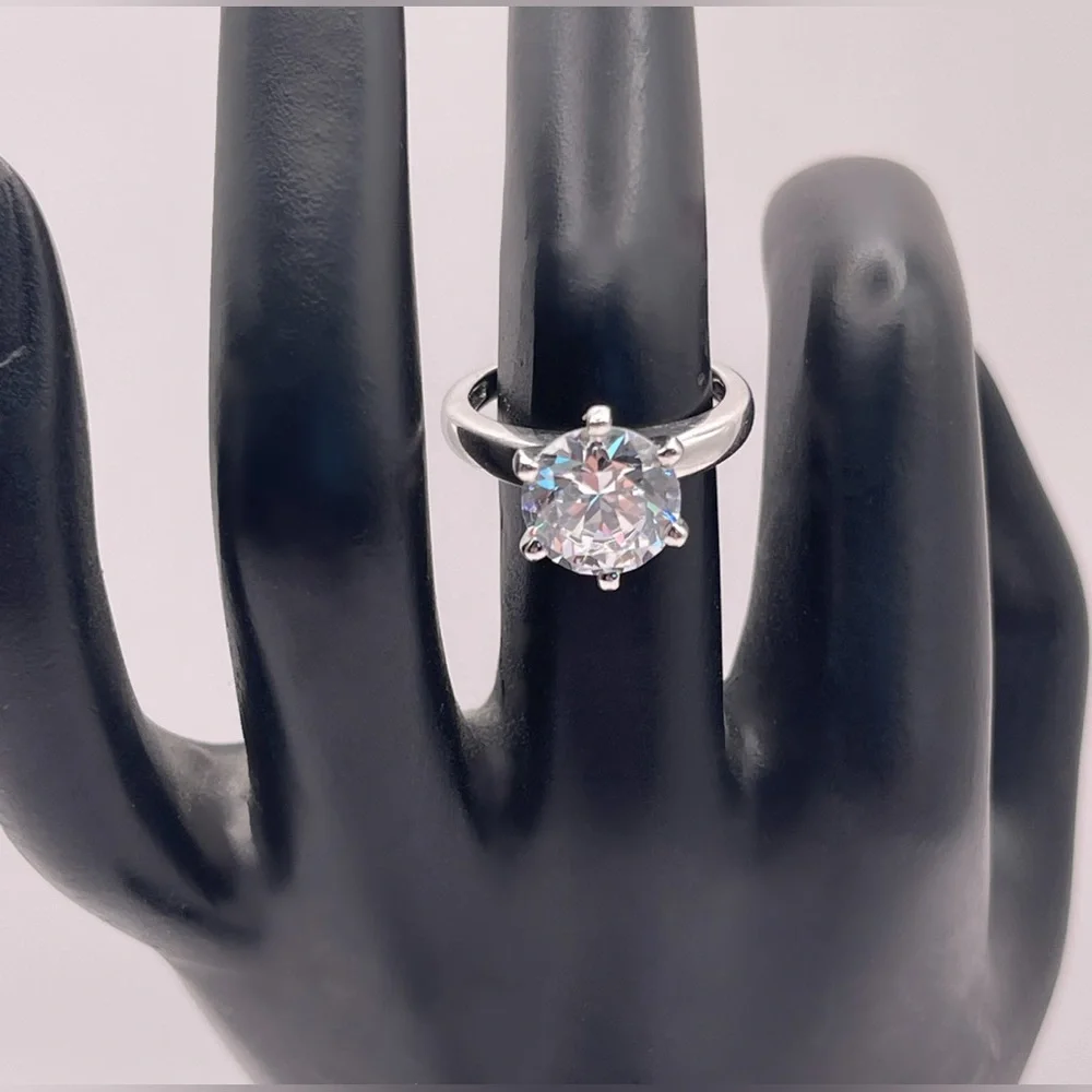 Two (2) carat cz solitaire in a 925 sterling silver setting. Size 6.25.